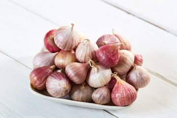 Fresh healthy garlic on white table