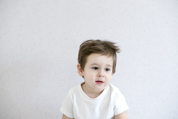 Fototapeta premium Portrait of little boy with upset, Kid sad face, Unhappy child looking out, Spoiled children concept