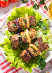 Grilled shish kebab or shashlik on white.