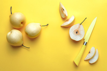 Yellow summer pears on yellow background