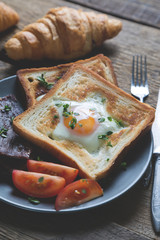 Scrambled eggs with toast and beef bacon