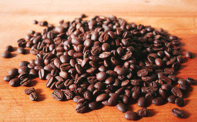 Coffee beans background on a wooden table