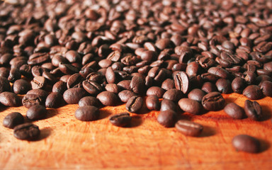 Coffee beans background on a wooden table