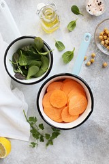 Various of super food products included sweet potato, spinach and chick pea for making of healthy vegetarian dinner. Overhead view 