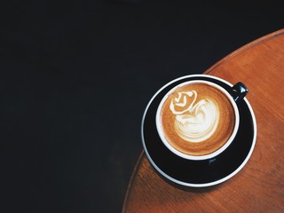  Hot Coffee latte art on wooden table in coffee shop,coffee time or coffee break.
