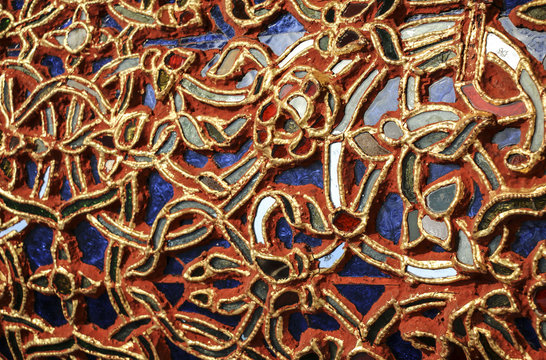 Detail of beautiful old abstract ceramic mosaic adorned building © Mauritius71