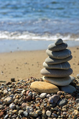 Fototapeta na wymiar Spa stones balance on beach.