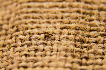 the rough fabric of the burlap