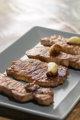 Roast pork shrubs meat with garlic on the plate