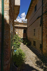 Narrow alley in spain on a sunny day with blue sky, Mallorca Europe