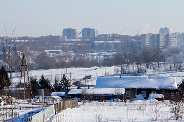 Obraz premium snow-covered village street on a winter day
