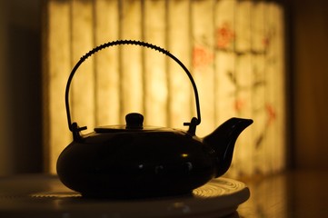 Chinese teapot and a paper lamp background - Interior design (Pesaro, Marche, Italy)