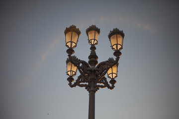 Fototapeta na wymiar AUGUST 2016 - MADRID, SPAIN: A six-headed street lamp in Madrid
