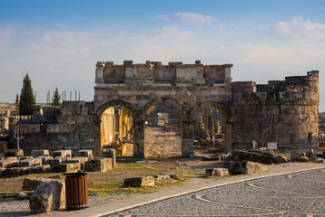 Ruins of Appollo temple with fortress at back in ancient Corinth, Peloponnese, Greece