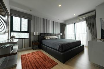 Fototapeta na wymiar Modern bedroom interior - bed at home bedroom