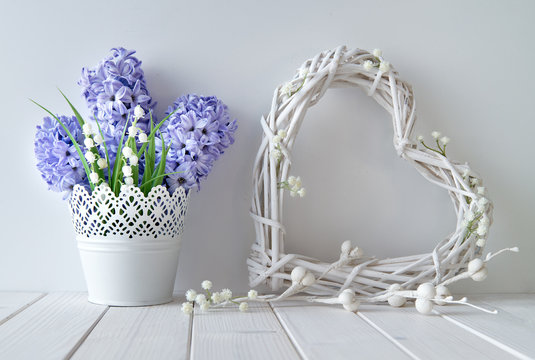  Blue hyacinth and lily of the valley flowers with a white wattle heart