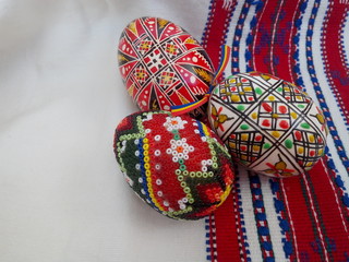 Romanian Easter eggs on traditional patterned hemp towel.