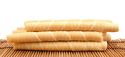Wafer roll sticks cream rolls on bamboo mat