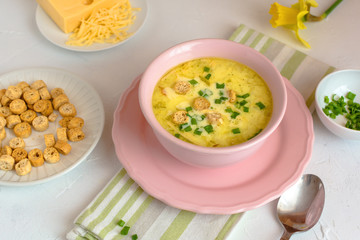 Cheese soup with croutons and fresh herbs.
