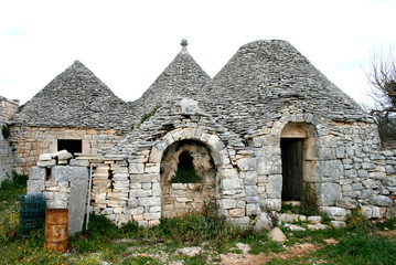 Ruins of ancient Trulli, typical old houses in Valle d'Itria, Puglia, Italy