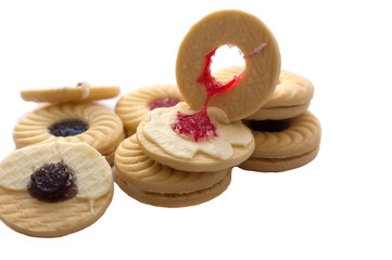 sandwich cookies with cream , blueberry and strawberry jams isolated on white background