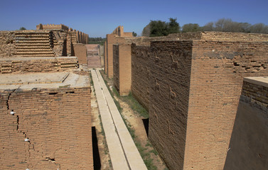 Brick walls decorated with bas-reliefs of the sacred bull and dragon at the original Ishtar gate in...