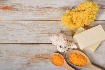 bath salt with olive oil and gray natural soap next to the shells with space for text