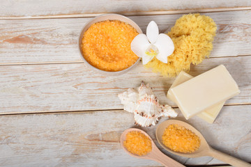 fruit bath salt with olive oil and gray natural soap next to the orchid with place for text