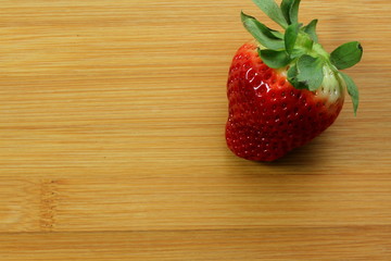 Strawberry on bamboo background
