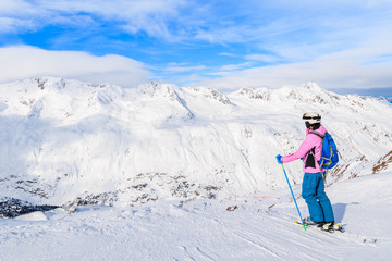 Young woman skier looking at beautiful mountain panorama in winter season, Obergurgl-Hochgurgl ski area, Austria