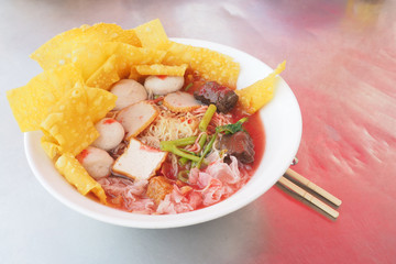 Yen taa fo egg noodle with crispy dumplings