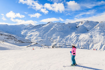 Fototapeta na wymiar Young woman skier looking at beautiful mountain panorama in winter season, Obergurgl-Hochgurgl ski area, Austria