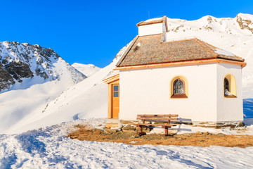 Small chapel near ski slope in Solden ski area on sunny winter day, Tirol, Austria