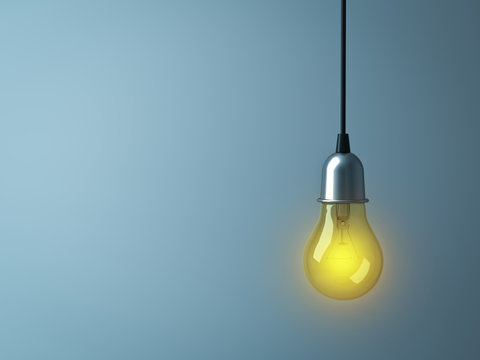 Hanging Light bulb glowing on dark cyan background . 3D rendering.