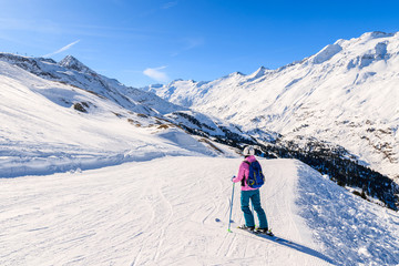 Fototapeta na wymiar Young woman skier on ski slope in winter season in Hochgurgl-Obergurgl mountain resort, Austria