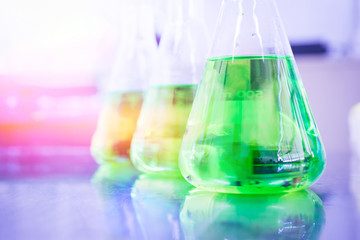 Green chemicals in beaker.