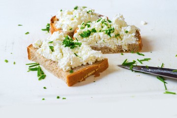 3 slices of bread with chive on white board.