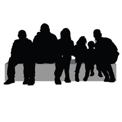 group of people sitting on a stone silhouette