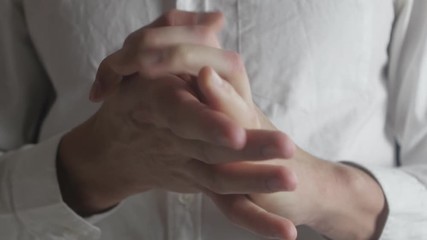 Close up Hands of caucasian man being anxious, nervous and uncomfortable.