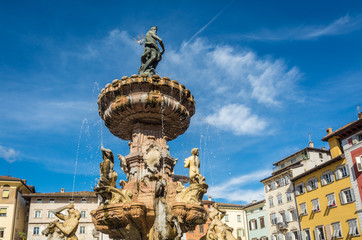 Trento city: main square Piazza Duomo, with clock tower and the Late Baroque Fountain of Neptune. City in Trentino Alto Adige, northern Italy, Europe