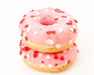 pink glazed donuts, with red hearts