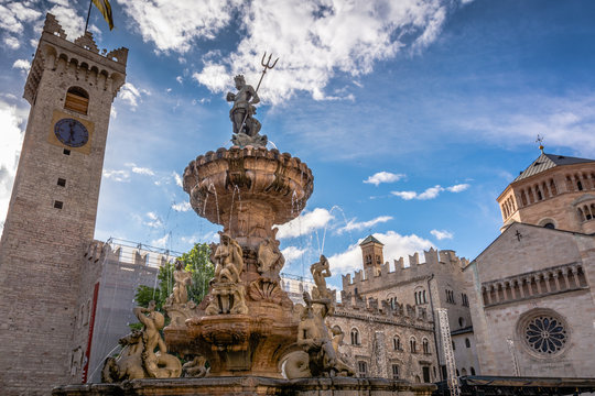 Trento city: main square Piazza Duomo, with clock tower and the Late Baroque Fountain of Neptune. City in Trentino Alto Adige, northern Italy, Europe