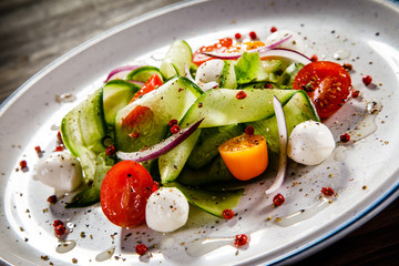 Caprese salad on wooden background