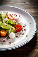 Caprese salad on wooden background