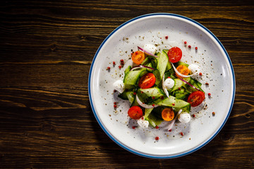 Caprese salad on wooden background