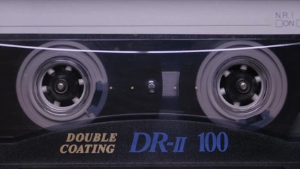 Audio Cassette in the Player. Close-up - Powered by Adobe