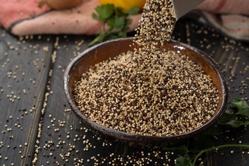Mix of organic white, yellow and black quinoa, dietary and healthy food