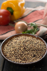 Mix of organic white, yellow and black quinoa, dietary and healthy food