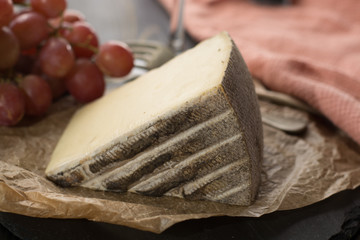 Tasting of ancient french demi soft cheese Tomme from French Alps, made from cow, goat or sheep skim milk, low fat french cheese