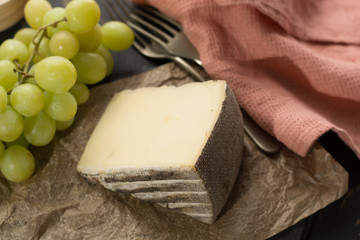 Tasting of ancient french demi soft cheese Tomme from French Alps, made from cow, goat or sheep skim milk, low fat french cheese